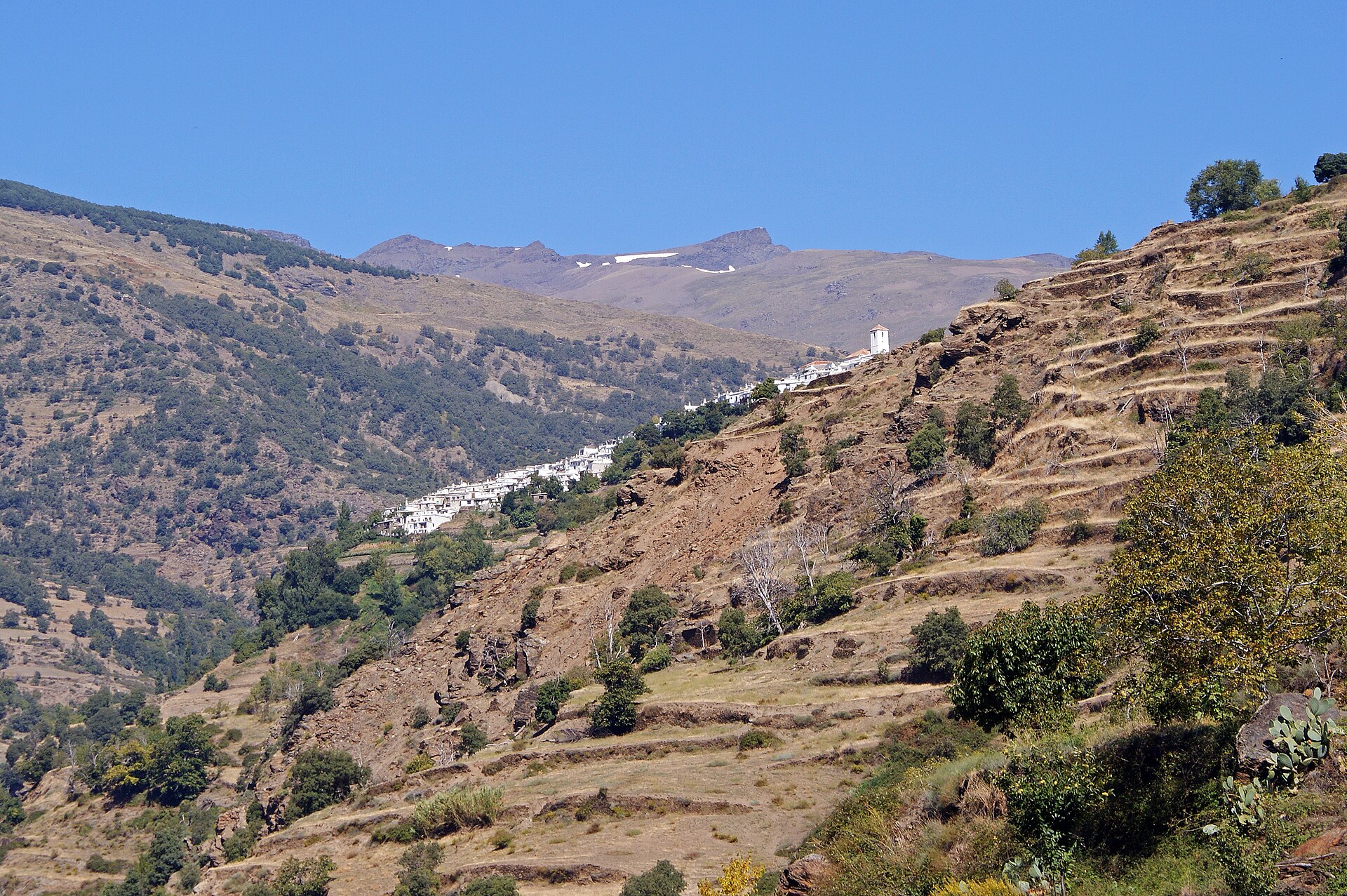 Bubión (5118904986).jpg Bubión - one of the small, white villages in the steep hills of Las Alpujarras, with the mountains of Sierra Nevada in the background.
